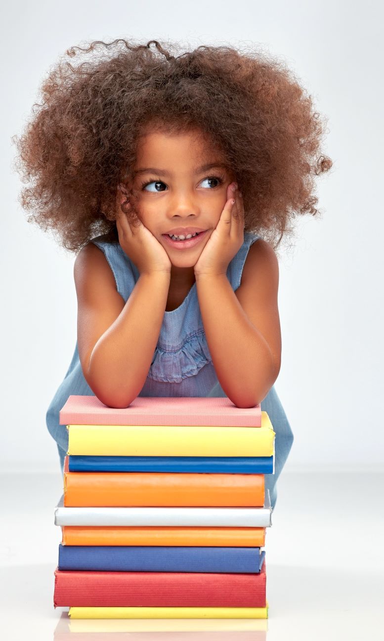 Girl leaning on stack of books
