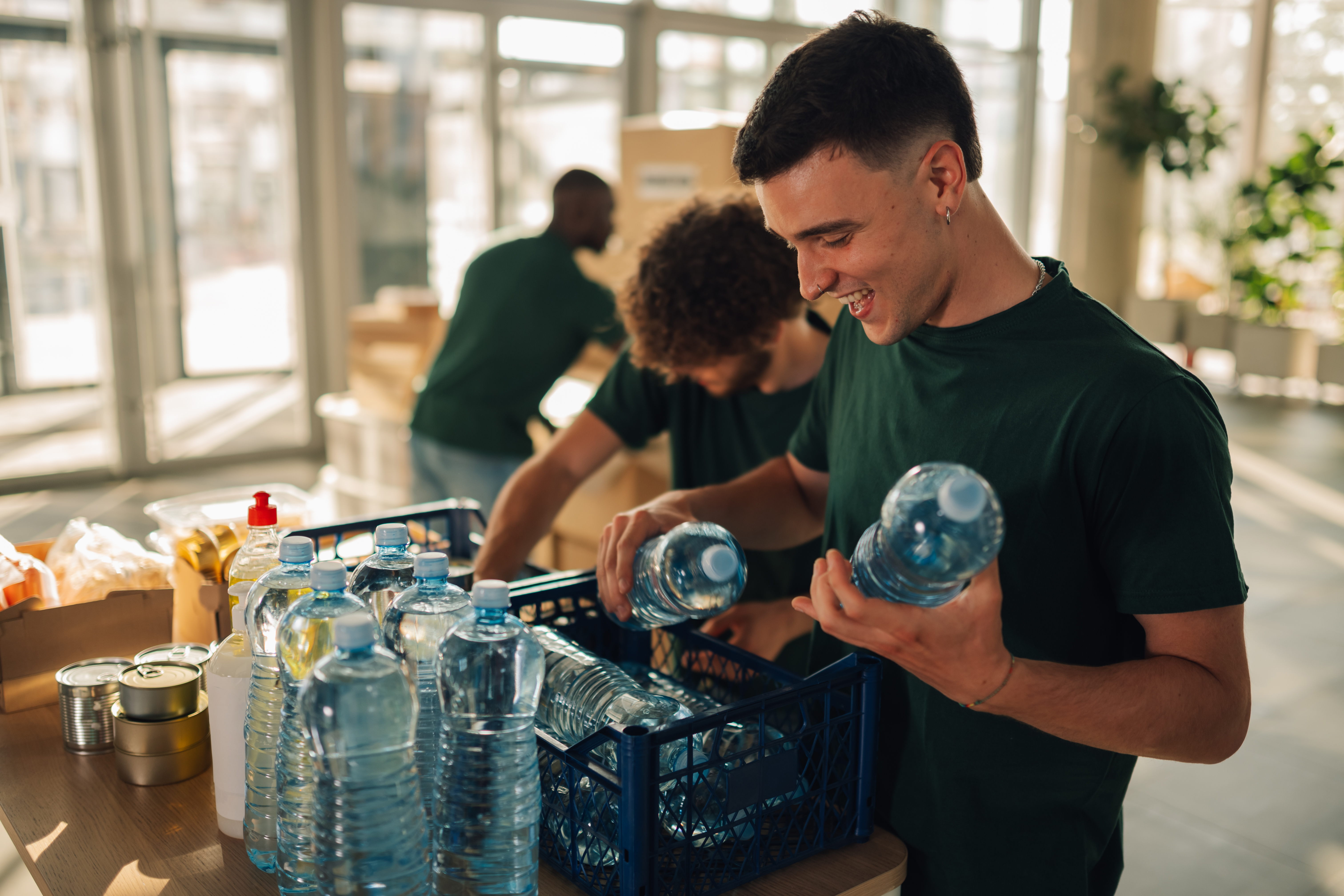 volunteer is packing water bottles into cases