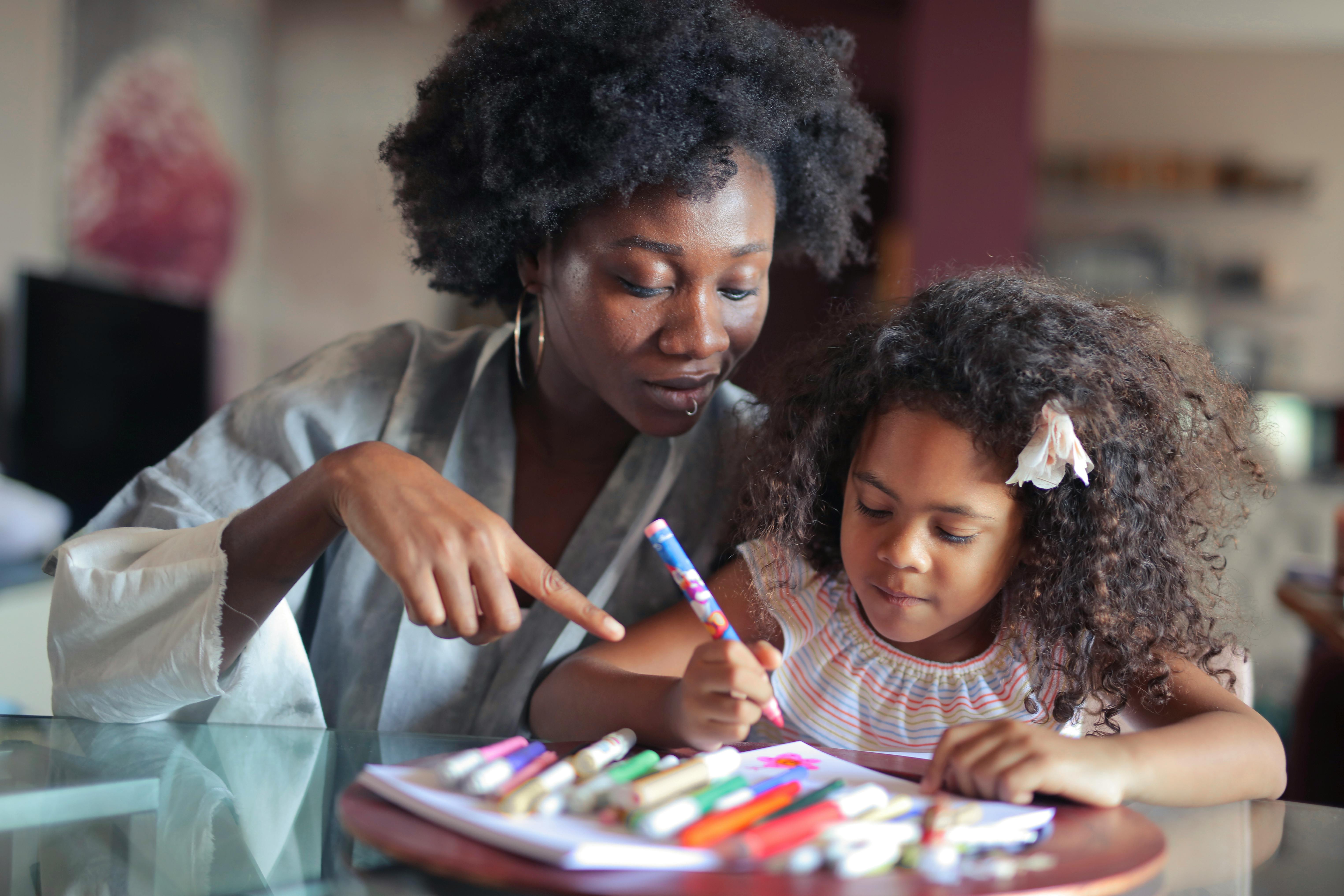 mom helping daughter with homework